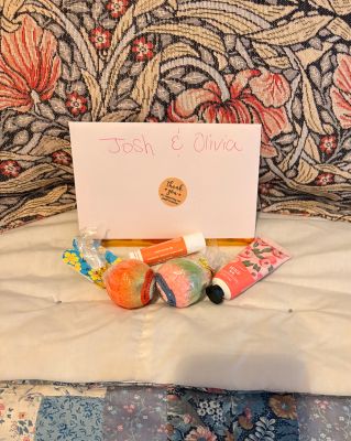 Two beautifully wrapped gift boxes resting on a cozy bedspread, perfect for any occasion.